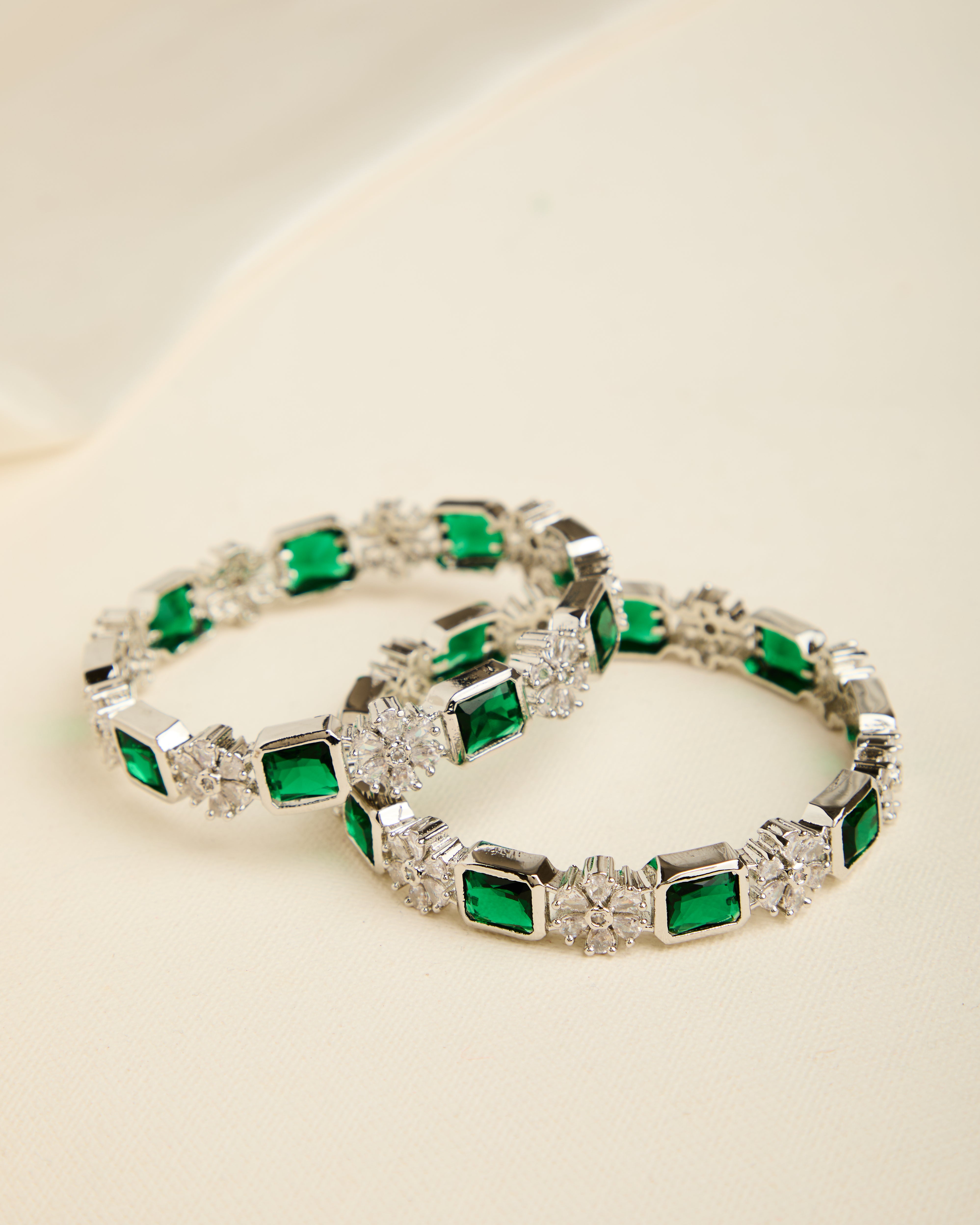 Luxurious Rhodium Plated Green Stone Studded Bangles for Women