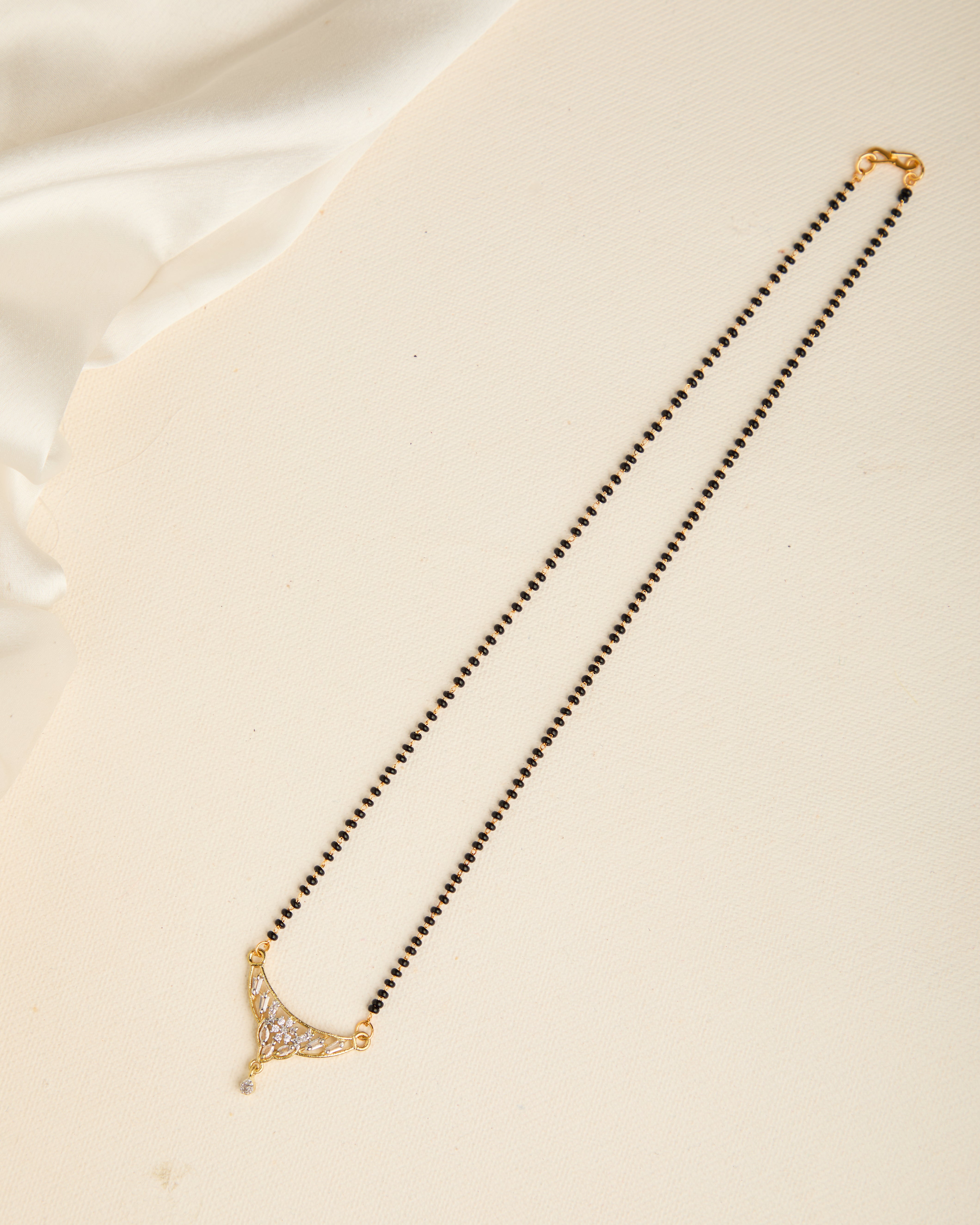 Sparkling Gold Plated Stone Studded Black Beads Mangalsutra