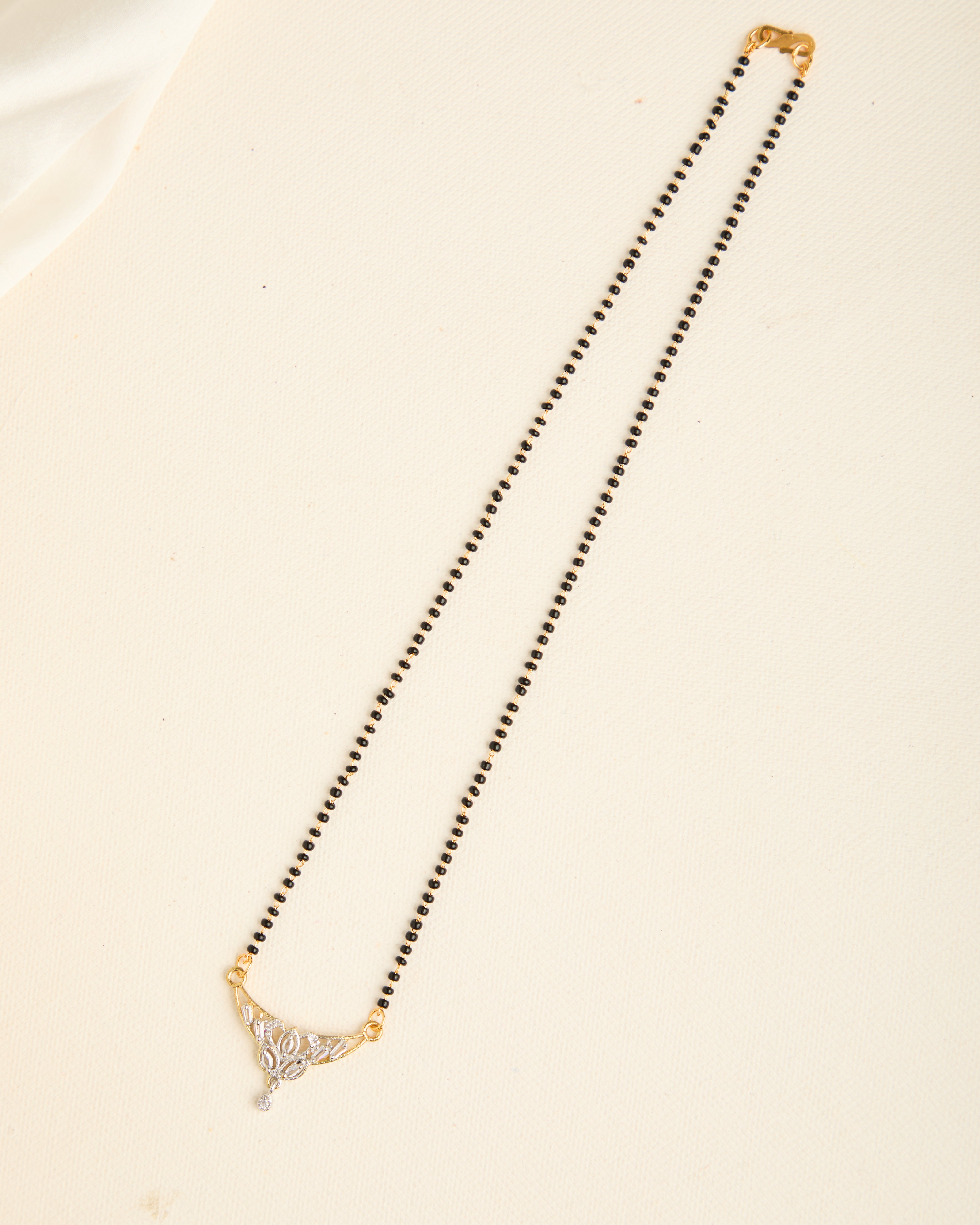 Sparkling Gold Plated Stone Studded Black Beads Mangalsutra